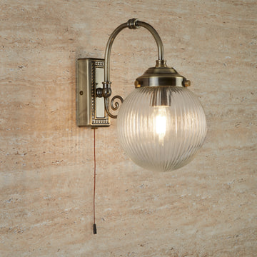 Belvue 1 Light Bathroom Wall Light Clear Globe Shade Antique Brass