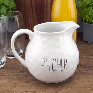 White Dimples Ceramic Beverage Pitcher With Label