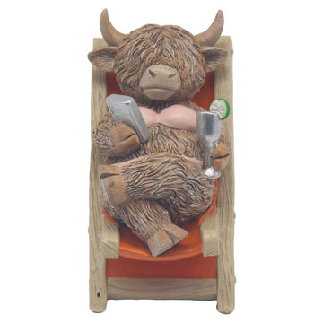 Highland Cow Sitting Deck Chair Champagne Ornament