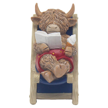 Highland Cow Sitting Deck Chair Reading Ornament