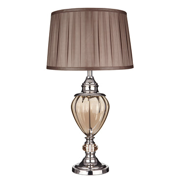 Greyson is a traditional lamp with a contemporary finish. The base features a large amber glass urn with a chrome finish